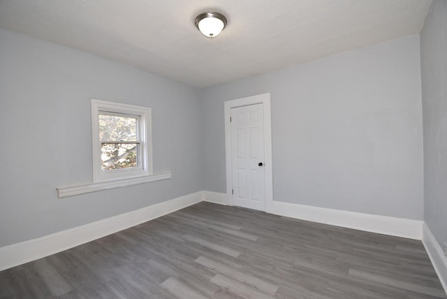 unfurnished room featuring wood-type flooring