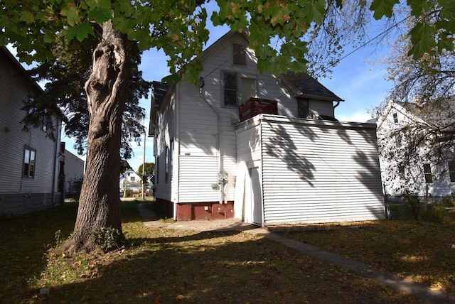 view of side of home featuring a garage