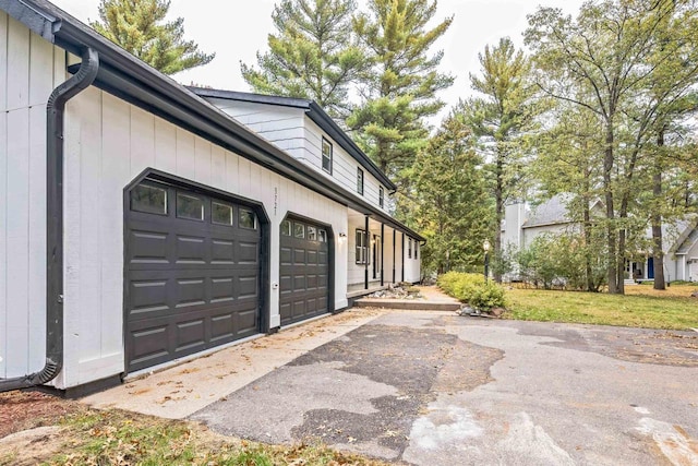 view of side of property featuring a garage