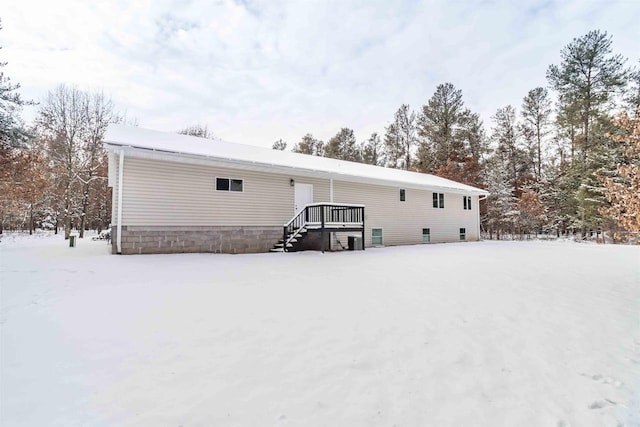 view of snow covered house