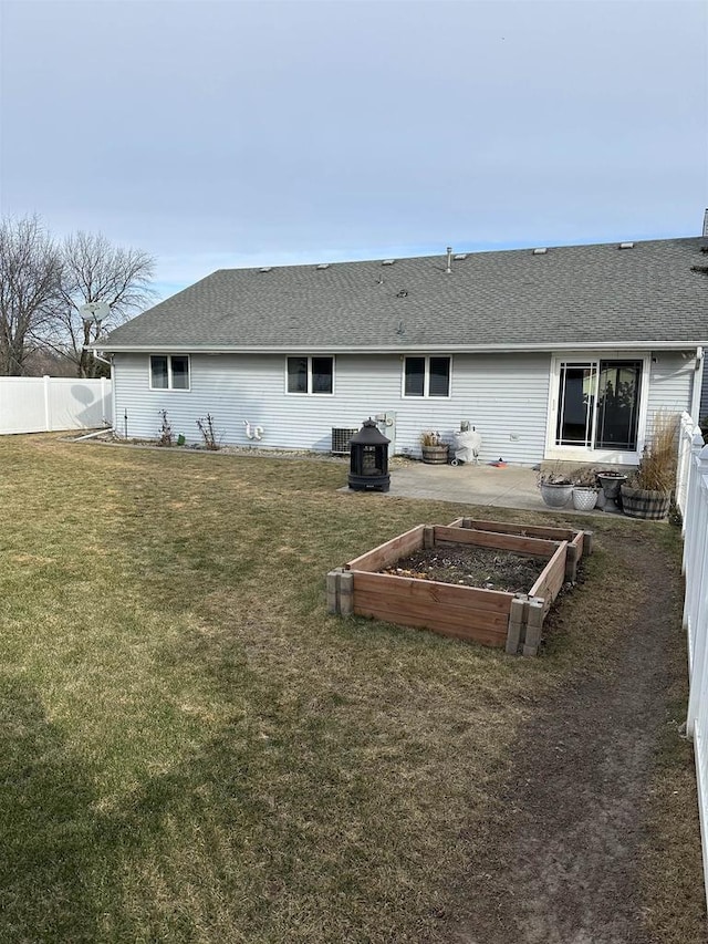 back of property with a yard