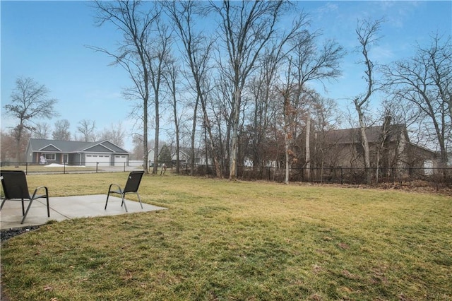 view of yard featuring fence and a patio area