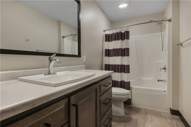 bathroom featuring vanity, toilet, and shower / bathtub combination with curtain