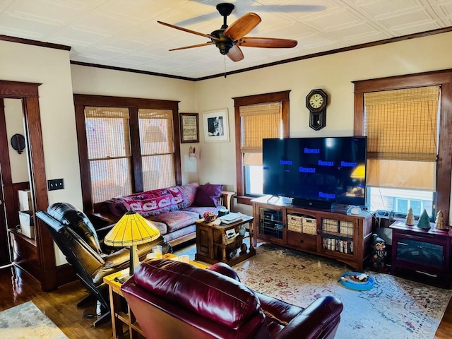 living room featuring dark hardwood / wood-style floors and ceiling fan