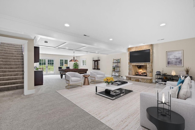 carpeted living room with beam ceiling, a stone fireplace, and billiards