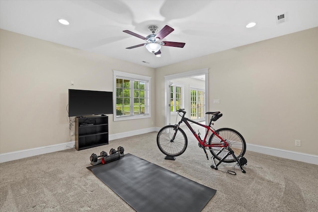 exercise room featuring carpet flooring and ceiling fan