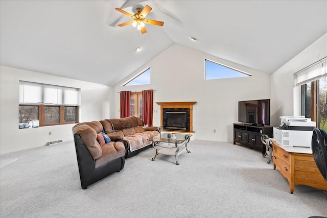 carpeted living room featuring high vaulted ceiling and ceiling fan