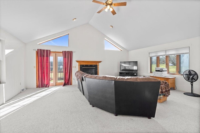 living room with ceiling fan, light carpet, and high vaulted ceiling