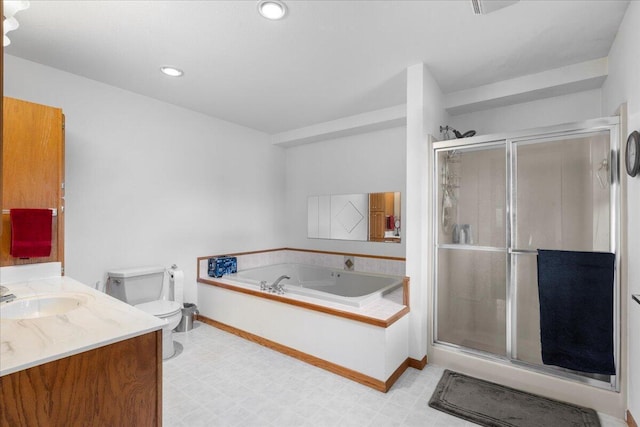 full bathroom featuring shower with separate bathtub, vanity, and toilet