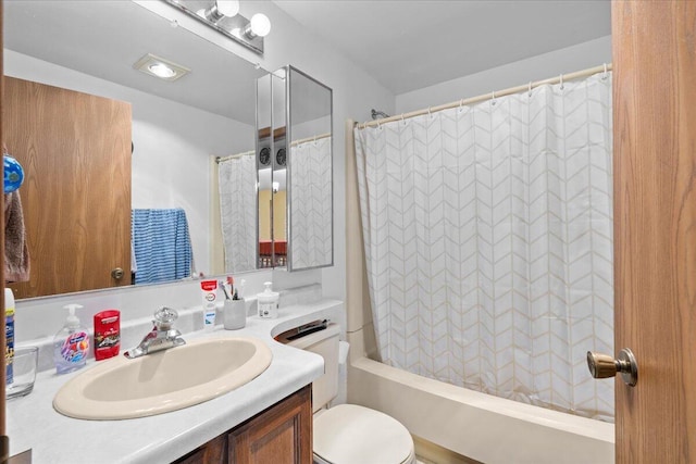 full bathroom with vanity, toilet, and shower / bath combo