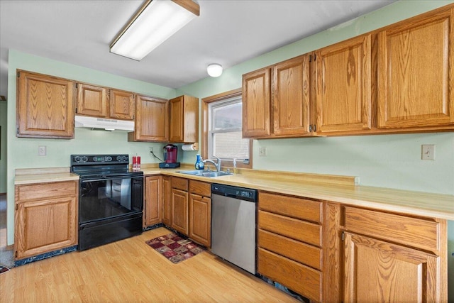 kitchen featuring electric range, dishwasher, light hardwood / wood-style flooring, and sink