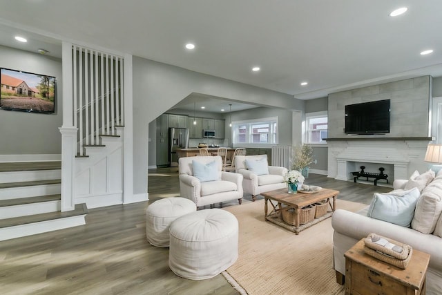 living room featuring a fireplace and hardwood / wood-style flooring