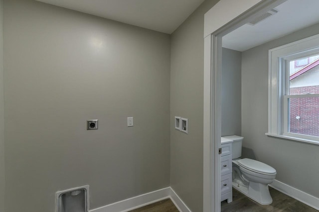 bathroom with hardwood / wood-style flooring, vanity, and toilet