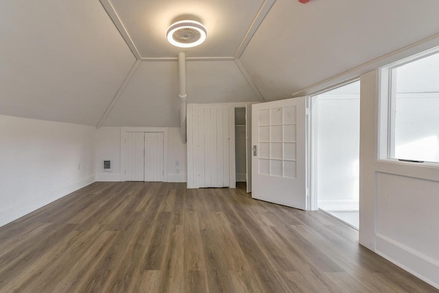 bonus room featuring vaulted ceiling and hardwood / wood-style flooring