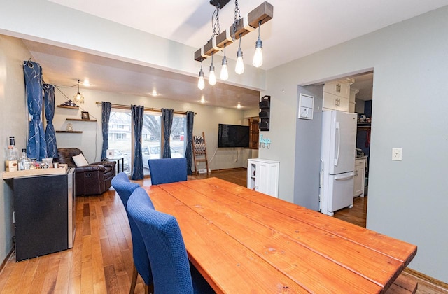 dining space featuring hardwood / wood-style floors