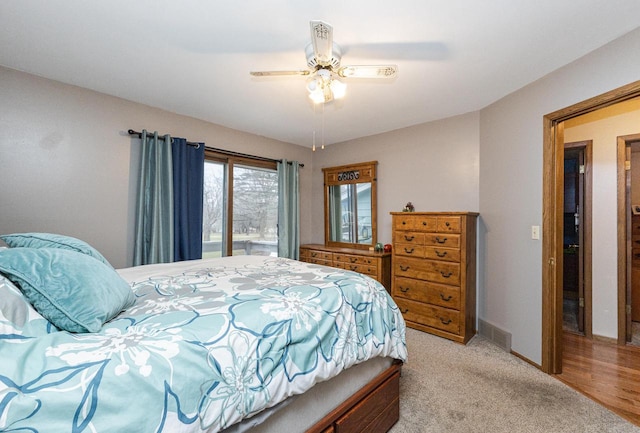 carpeted bedroom with access to outside and ceiling fan