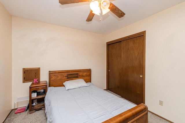 bedroom with light carpet, a closet, and ceiling fan