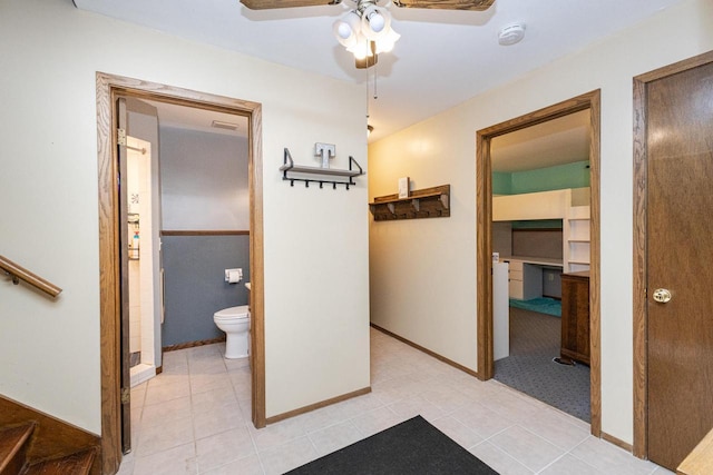 hall featuring light tile patterned floors