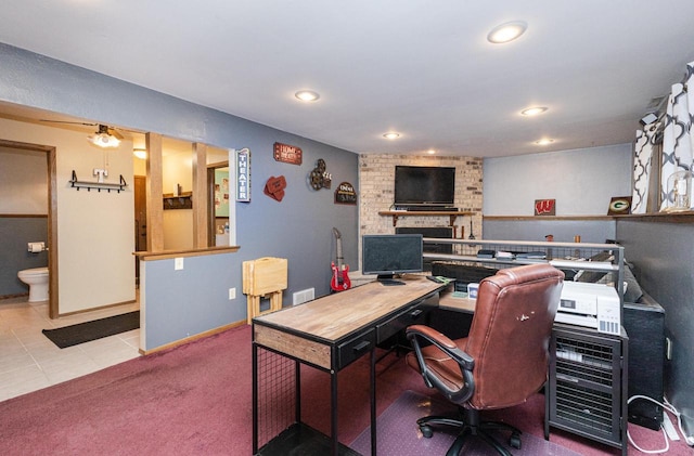 carpeted home office with a fireplace