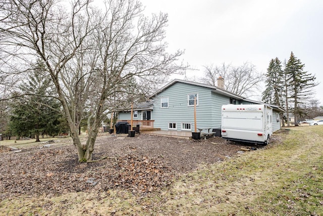 view of home's exterior featuring a wooden deck