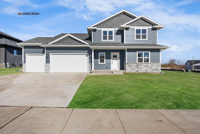 craftsman-style house with a garage and a front lawn