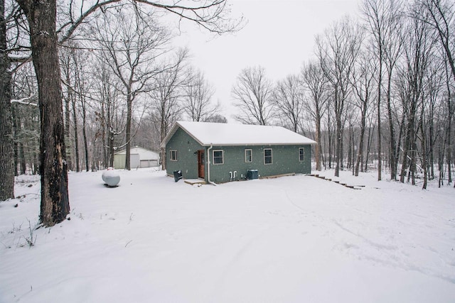 view of front of property with cooling unit and an outdoor structure