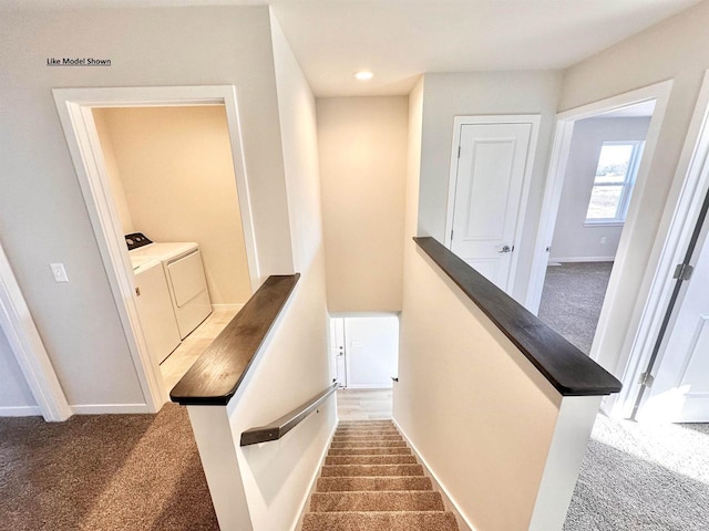 stairway with carpet and washing machine and dryer