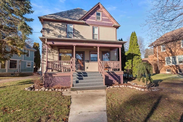 victorian house with covered porch and a front yard