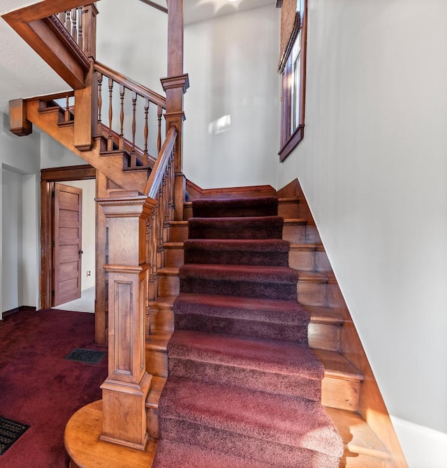 stairway with carpet flooring