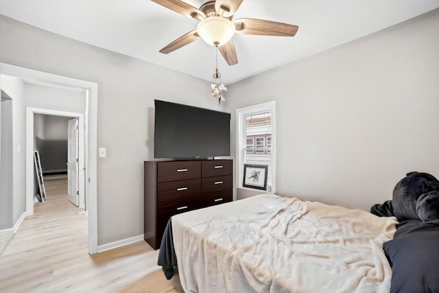 bedroom featuring ceiling fan and light hardwood / wood-style floors