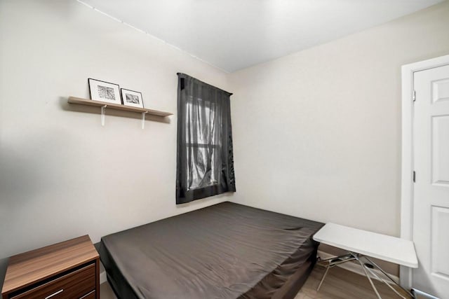 bedroom featuring wood-type flooring