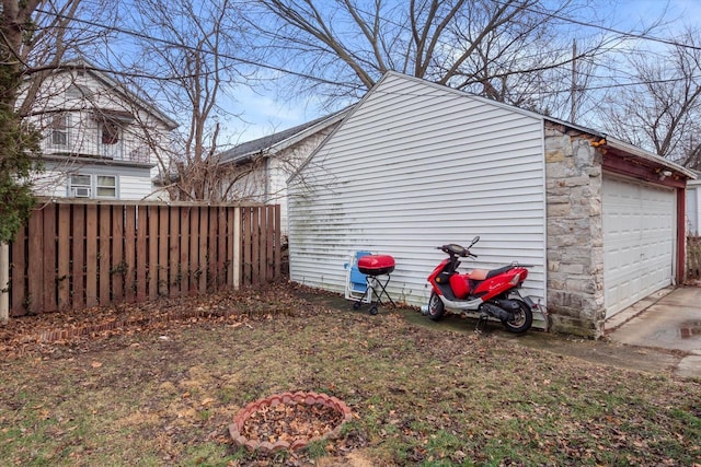 view of side of property featuring a garage and an outdoor structure