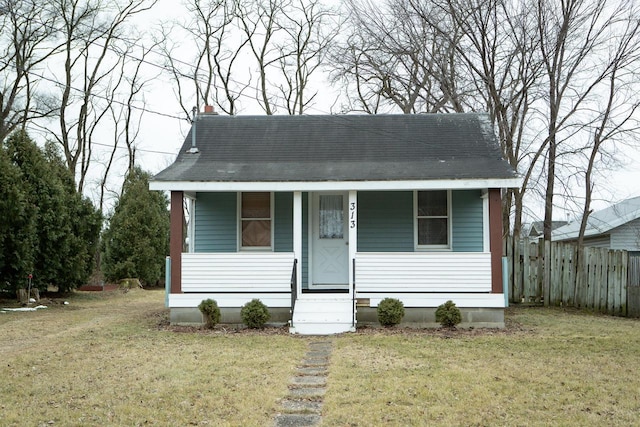 bungalow-style home featuring a front lawn