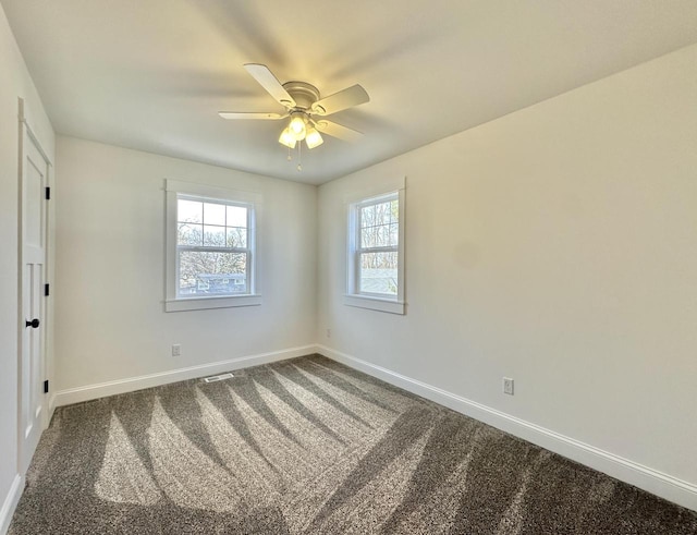 spare room with carpet flooring and ceiling fan