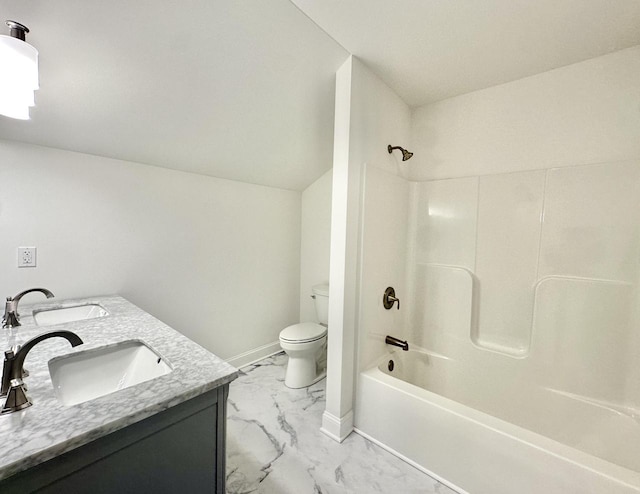 full bathroom featuring vanity, bathing tub / shower combination, and toilet