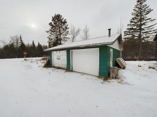 view of snow covered garage