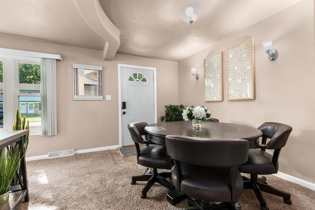 dining space with carpet