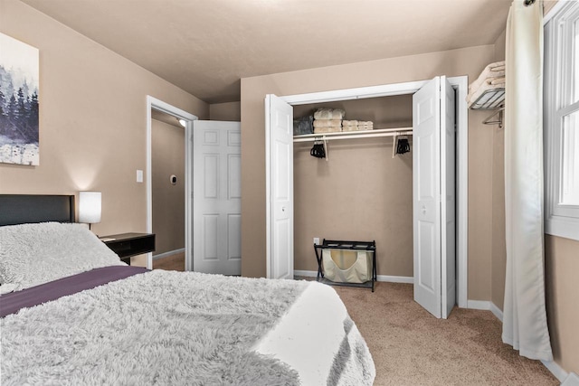 carpeted bedroom with a closet