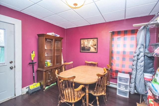 239 W Paradise Dr, West Bend, WI 53095 - dining area featuring a paneled ceiling, dark hardwood / wood-style floors, and baseboard heating