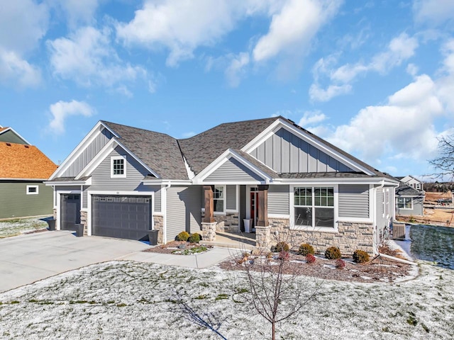 craftsman-style home with a porch and a garage