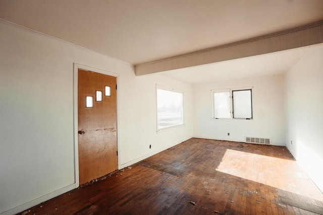 spare room with dark hardwood / wood-style flooring