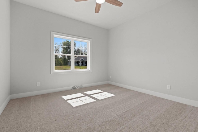 empty room with light carpet and ceiling fan