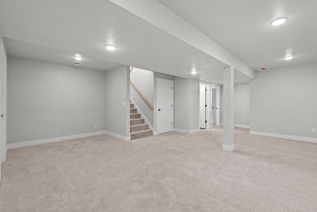 basement with light colored carpet