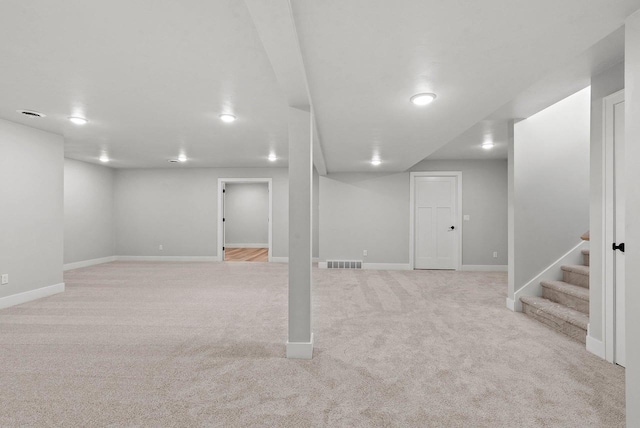 basement with light carpet