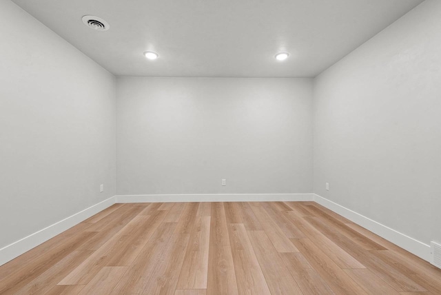 spare room featuring light wood-type flooring