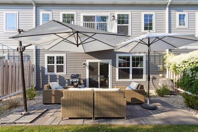 rear view of property featuring central AC, a patio, and an outdoor hangout area