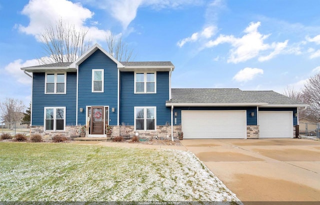 view of front facade with a front yard and a garage