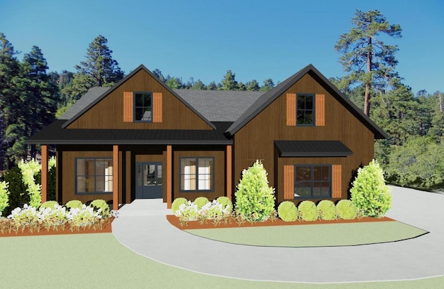 view of front of house featuring a standing seam roof, covered porch, and metal roof