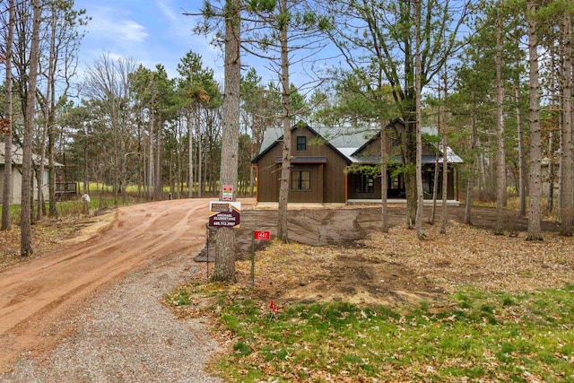 view of side of home with driveway