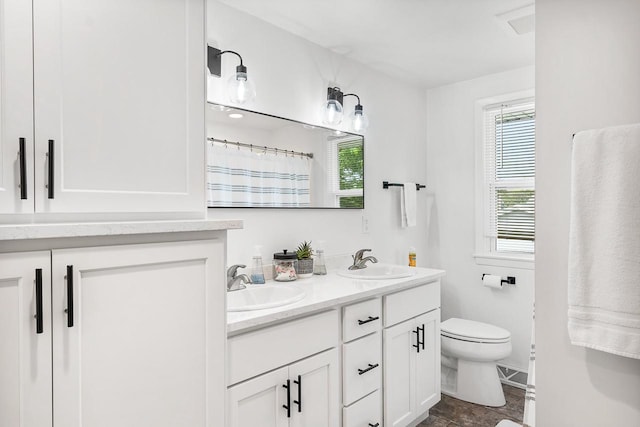 bathroom with vanity and toilet